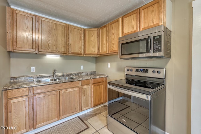 2642 Broad St, Bristol, TN 37620 - kitchen featuring appliances with stainless steel finishes and light tile patterned floors