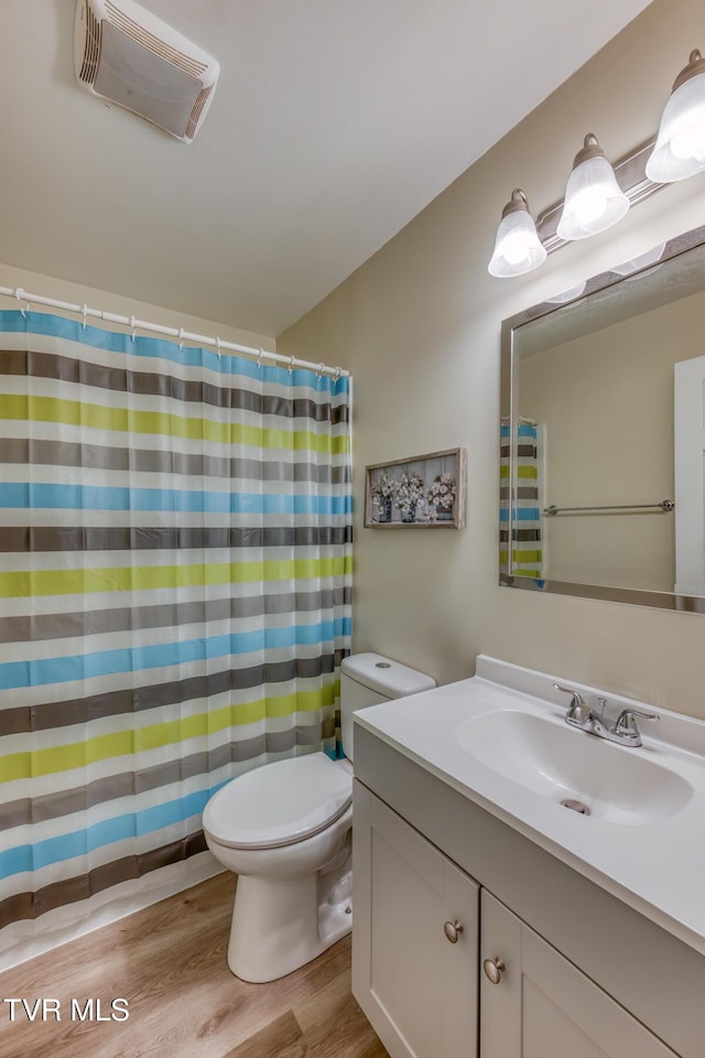 2642 Broad St, Bristol, TN 37620 - bathroom with vanity, wood finished floors, and a shower with shower curtain
