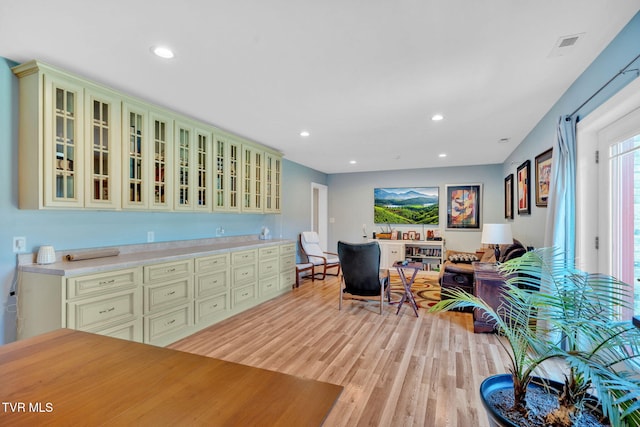 788 Watauga Rd, Watauga, TN 37694 - kitchen with cream cabinetry, light wood-style flooring, light countertops, glass insert cabinets, and recessed lighting