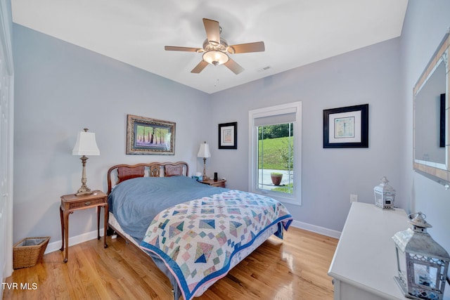 788 Watauga Rd, Watauga, TN 37694 - bedroom with light wood finished floors and ceiling fan