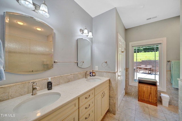 788 Watauga Rd, Watauga, TN 37694 - full bath featuring tile walls, double vanity, wainscoting, and marble finish flooring