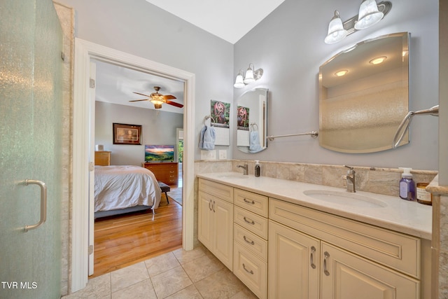 788 Watauga Rd, Watauga, TN 37694 - full bathroom featuring double vanity, connected bathroom, tile patterned floors, ceiling fan, and a shower stall
