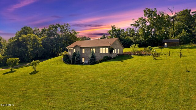 788 Watauga Rd, Watauga, TN 37694 - yard at dusk with a lawn