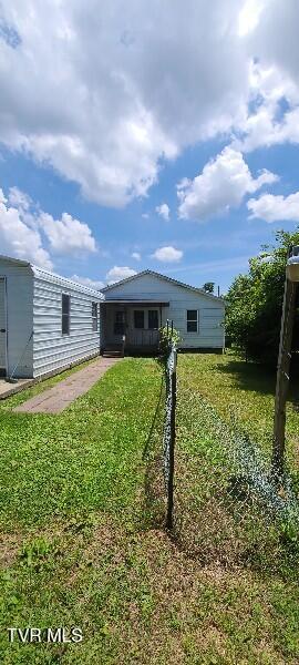 1814 Park St, Kingsport, TN 37664 - back of house featuring a lawn