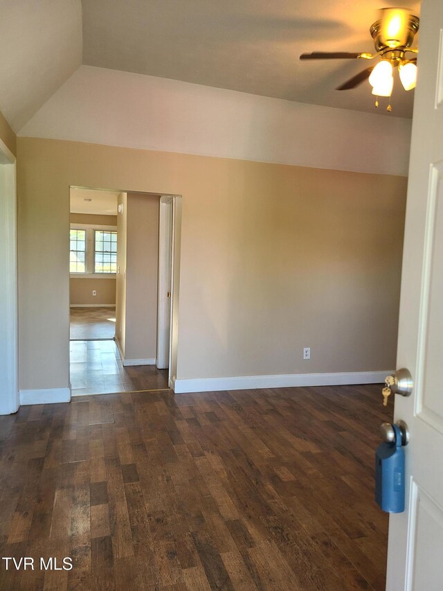 1814 Park St, Kingsport, TN 37664 - unfurnished room with dark wood finished floors, ceiling fan, and vaulted ceiling