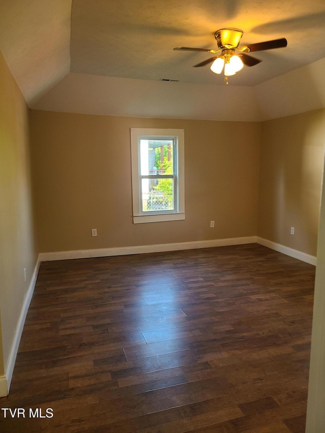 1814 Park St, Kingsport, TN 37664 - spare room with dark wood-style flooring, a ceiling fan, and vaulted ceiling