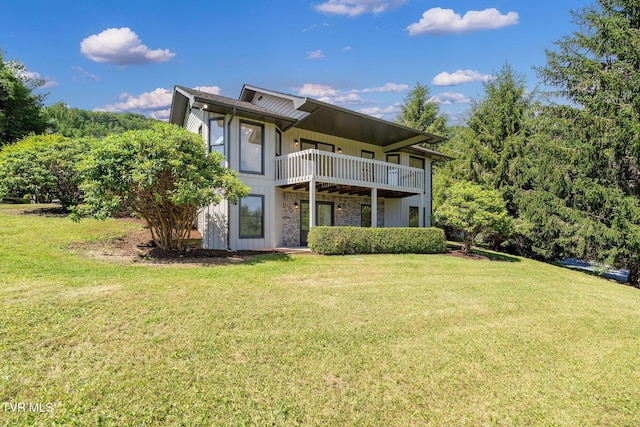 119 Orchard Meadows Ln, Roan Mountain, TN 37687 - back of house featuring a yard, a balcony, and board and batten siding
