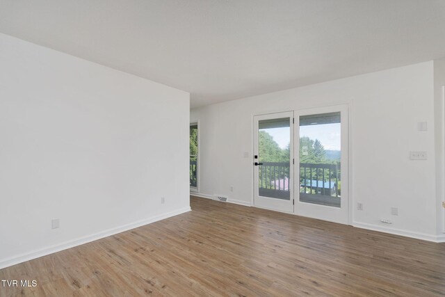 119 Orchard Meadows Ln, Roan Mountain, TN 37687 - unfurnished room featuring wood finished floors