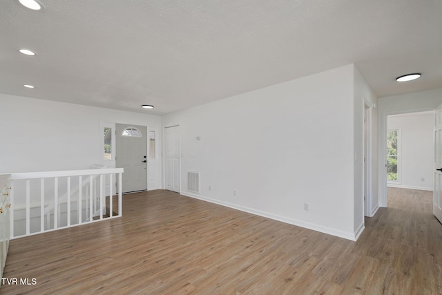 119 Orchard Meadows Ln, Roan Mountain, TN 37687 - unfurnished room featuring wood finished floors and recessed lighting