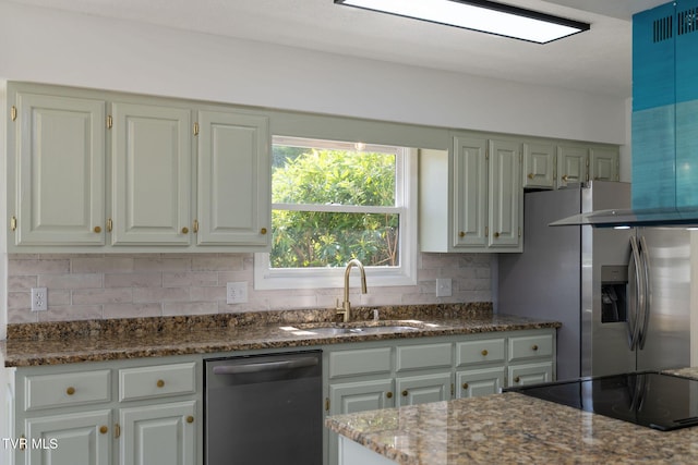 119 Orchard Meadows Ln, Roan Mountain, TN 37687 - kitchen featuring appliances with stainless steel finishes, decorative backsplash, and dark stone countertops