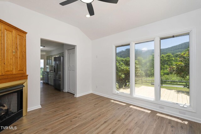 119 Orchard Meadows Ln, Roan Mountain, TN 37687 - unfurnished living room with light wood-style flooring, vaulted ceiling, ceiling fan, plenty of natural light, and recessed lighting