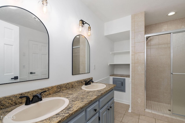 119 Orchard Meadows Ln, Roan Mountain, TN 37687 - bathroom featuring a stall shower, double vanity, and tile patterned flooring