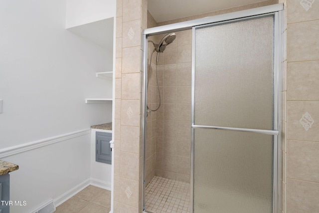 119 Orchard Meadows Ln, Roan Mountain, TN 37687 - bathroom with a shower stall, tile patterned flooring, and vanity