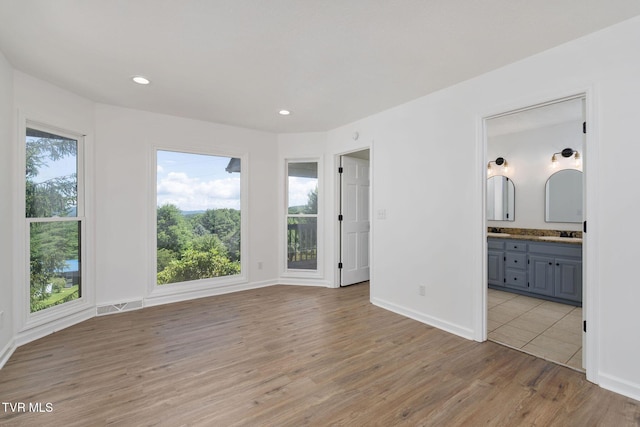 119 Orchard Meadows Ln, Roan Mountain, TN 37687 - unfurnished room with light wood-style floors and recessed lighting