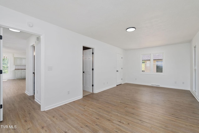 119 Orchard Meadows Ln, Roan Mountain, TN 37687 - unfurnished room featuring light wood finished floors and baseboards