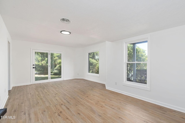 119 Orchard Meadows Ln, Roan Mountain, TN 37687 - spare room featuring baseboards and light wood-style flooring