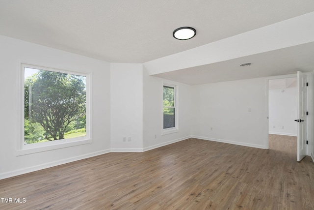 119 Orchard Meadows Ln, Roan Mountain, TN 37687 - spare room featuring wood finished floors and baseboards