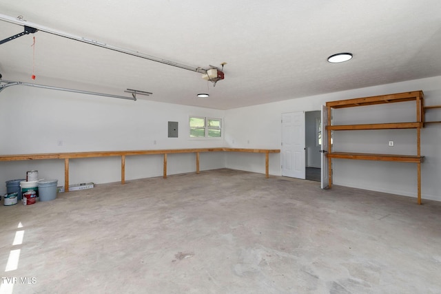 119 Orchard Meadows Ln, Roan Mountain, TN 37687 - garage featuring a garage door opener and electric panel
