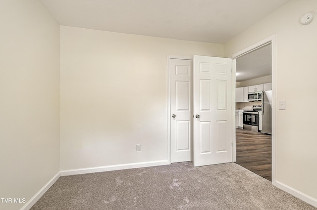 117 Maverick Rd, Jonesborough, TN 37659 - unfurnished bedroom featuring dark colored carpet and freestanding refrigerator