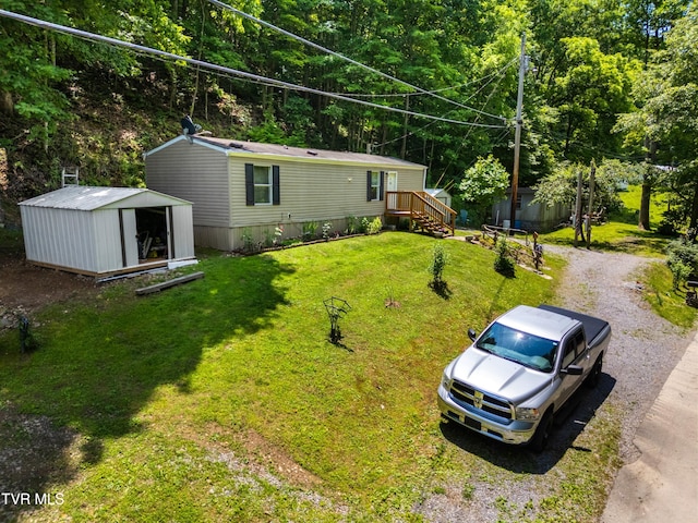 904 Briar Fork Rd, Bean Station, TN 37708 - view of green lawn featuring a storage unit