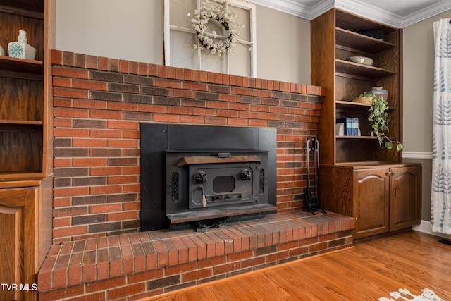 245 Highland Hills Dr, Gray, TN 37615 - detailed view of a wood stove, crown molding, and wood finished floors