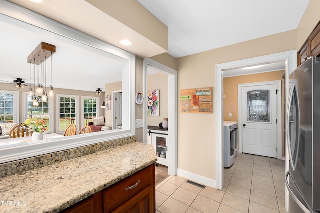 245 Highland Hills Dr, Gray, TN 37615 - kitchen featuring freestanding refrigerator, ceiling fan, light tile patterned flooring, pendant lighting, and washer / clothes dryer