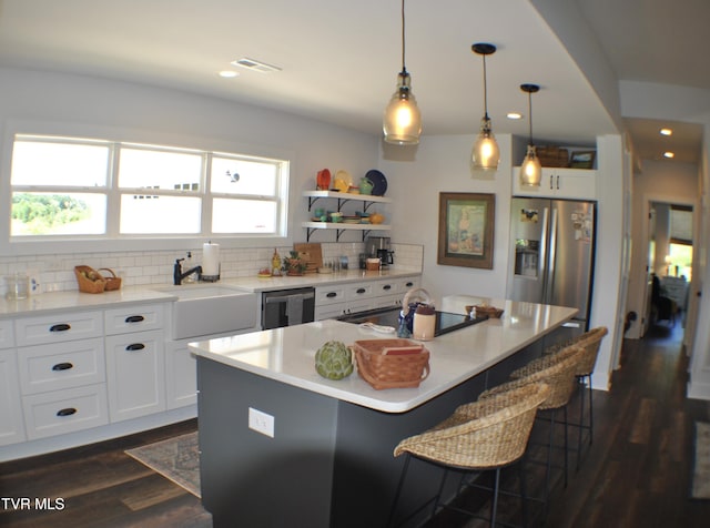 286 Sliger Rd, Jonesborough, TN 37659 - kitchen with stainless steel refrigerator with ice dispenser, dishwasher, tasteful backsplash, open shelves, and a breakfast bar
