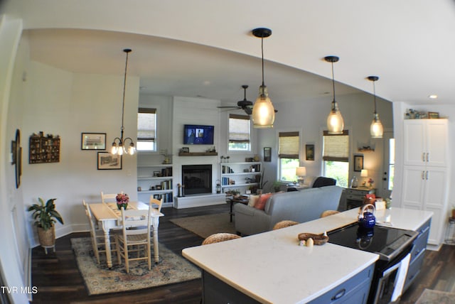 286 Sliger Rd, Jonesborough, TN 37659 - kitchen featuring dark wood-style flooring, a center island, a ceiling fan, light countertops, and pendant lighting