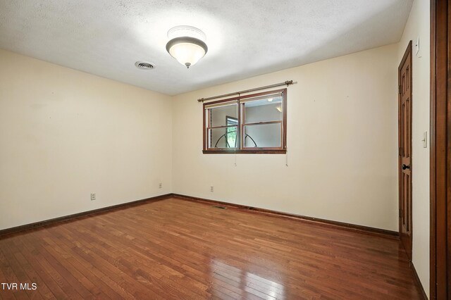 134 Richmond Hts, Jonesville, VA 24263 - unfurnished room featuring hardwood / wood-style flooring and a textured ceiling