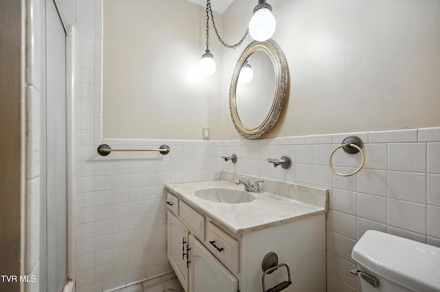 134 Richmond Hts, Jonesville, VA 24263 - bathroom with vanity, tile walls, and wainscoting