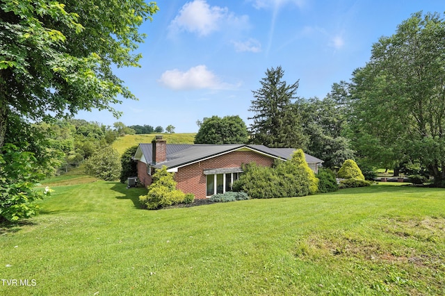 134 Richmond Hts, Jonesville, VA 24263 - view of home's exterior with a yard and a chimney