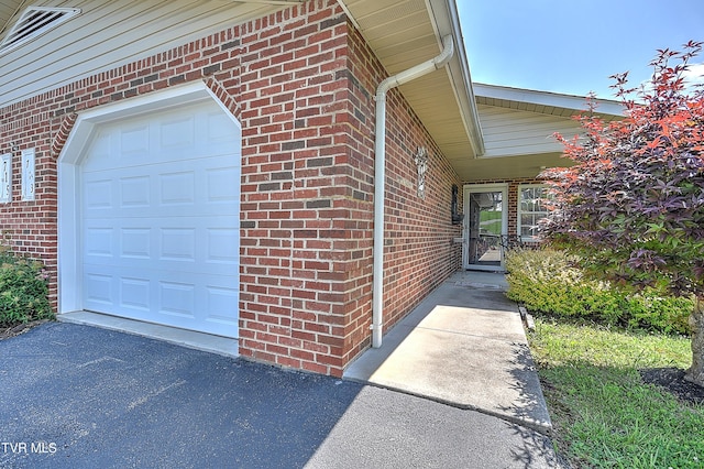 713 Teasel Dr Unit 0, Kingsport, TN 37660 - view of side of property featuring brick siding, a garage, and driveway