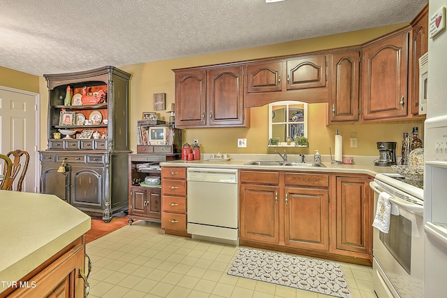 713 Teasel Dr Unit 0, Kingsport, TN 37660 - kitchen with white dishwasher, stove, light tile patterned floors, light countertops, and a textured ceiling