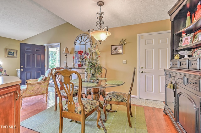 713 Teasel Dr Unit 0, Kingsport, TN 37660 - dining area with a textured ceiling, light wood-style flooring, and lofted ceiling