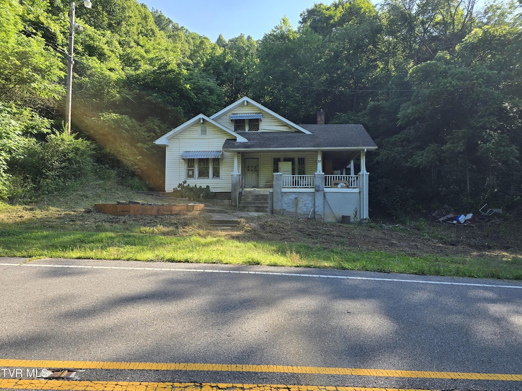 14461 Bristol Hwy, Bristol, VA 24202 - bungalow-style house with a view of trees, a porch, and a chimney