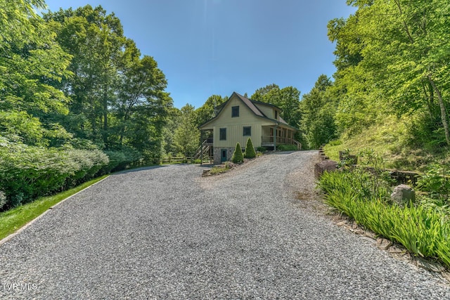 410 Eagle Ridge Rd, Roan Mountain, TN 37687 - view of front of home with gravel driveway and stairway