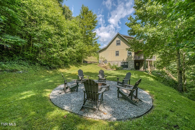 410 Eagle Ridge Rd, Roan Mountain, TN 37687 - view of grassy yard with a fire pit and a wooden deck