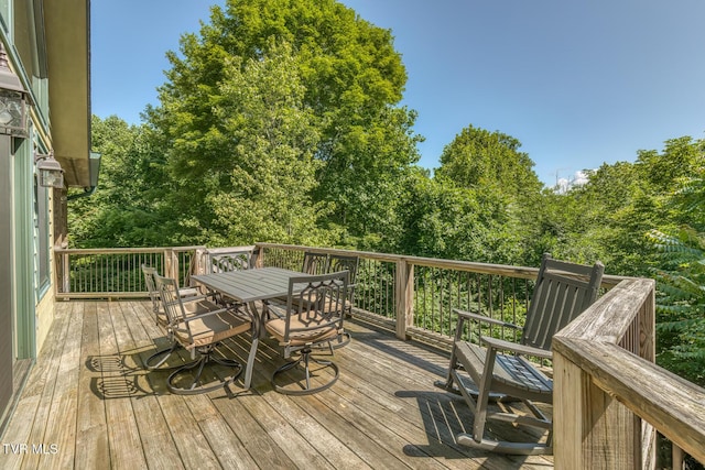 410 Eagle Ridge Rd, Roan Mountain, TN 37687 - wooden terrace with outdoor dining space and view of wooded area