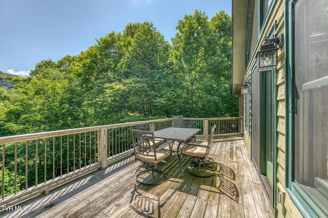 410 Eagle Ridge Rd, Roan Mountain, TN 37687 - wooden terrace featuring outdoor dining space