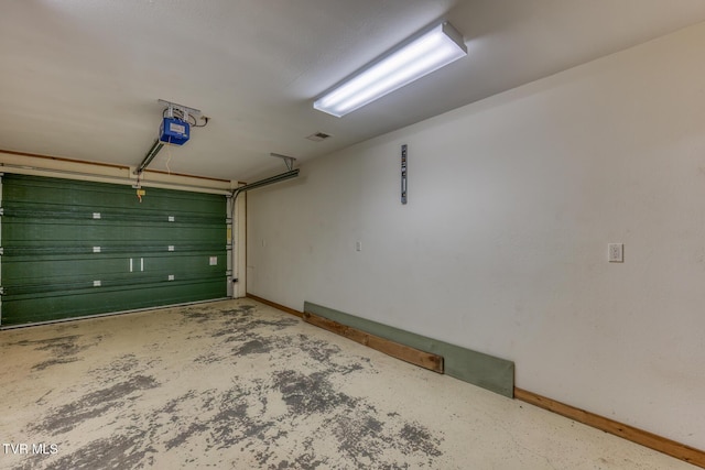 410 Eagle Ridge Rd, Roan Mountain, TN 37687 - garage featuring a garage door opener and baseboards