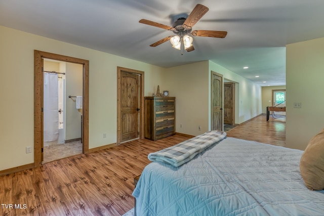 410 Eagle Ridge Rd, Roan Mountain, TN 37687 - bedroom with wood finished floors, recessed lighting, connected bathroom, and a ceiling fan