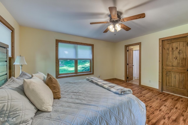 410 Eagle Ridge Rd, Roan Mountain, TN 37687 - bedroom with wood finished floors and a ceiling fan