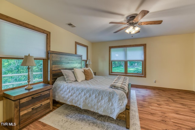 410 Eagle Ridge Rd, Roan Mountain, TN 37687 - bedroom featuring wood finished floors and a ceiling fan
