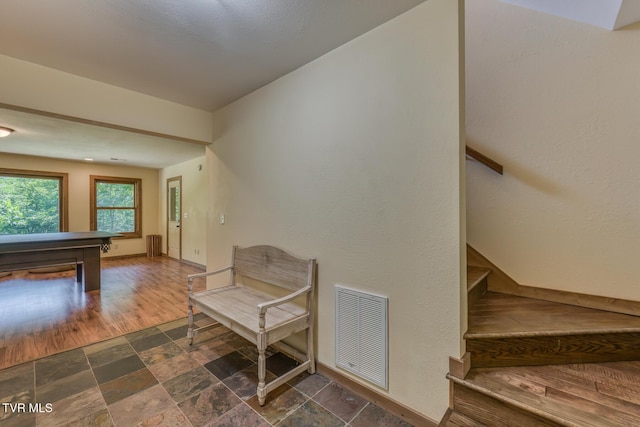 410 Eagle Ridge Rd, Roan Mountain, TN 37687 - living area with dark stone finish flooring, stairs, and billiards table