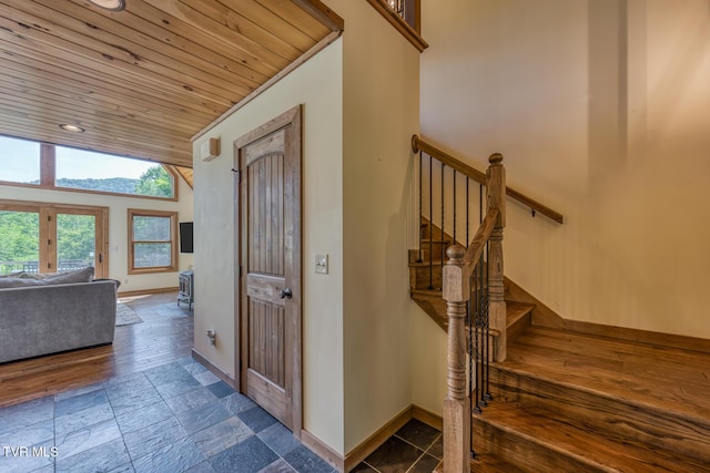 410 Eagle Ridge Rd, Roan Mountain, TN 37687 - stairway with wood ceiling, stone tile floors, and recessed lighting