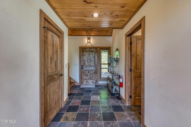 410 Eagle Ridge Rd, Roan Mountain, TN 37687 - foyer entrance featuring wooden ceiling, stone finish floors, recessed lighting, and stairway