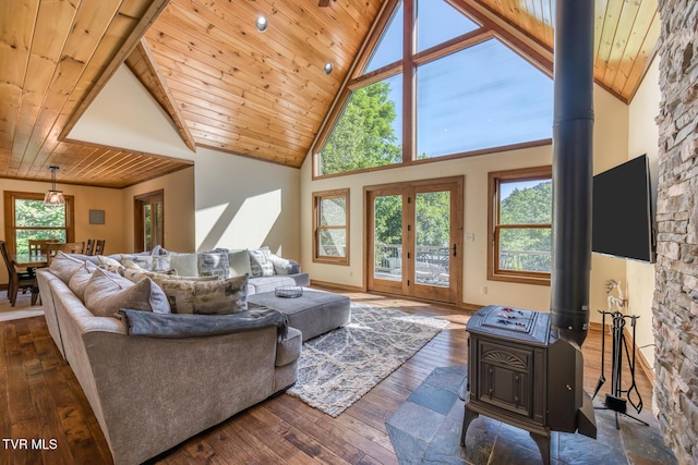 410 Eagle Ridge Rd, Roan Mountain, TN 37687 - living room featuring wooden ceiling, a wood stove, plenty of natural light, dark wood finished floors, and high vaulted ceiling