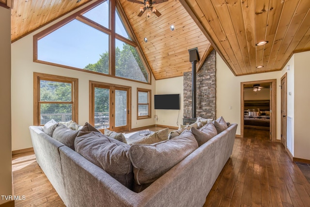 410 Eagle Ridge Rd, Roan Mountain, TN 37687 - living room featuring a wooden ceiling with exposed beams, ceiling fan, hardwood / wood-style flooring, a wood stove, and recessed lighting