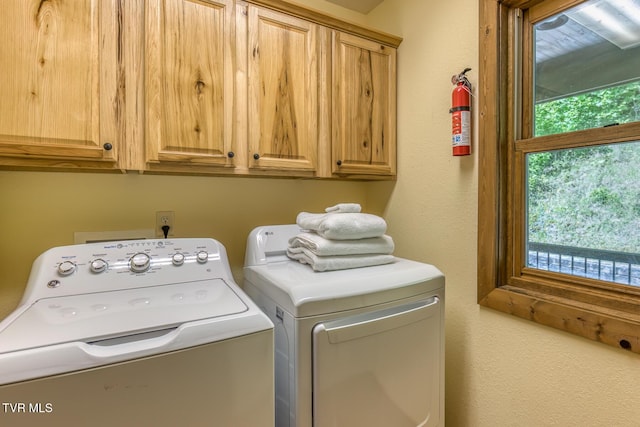 410 Eagle Ridge Rd, Roan Mountain, TN 37687 - laundry room featuring cabinet space and separate washer and dryer