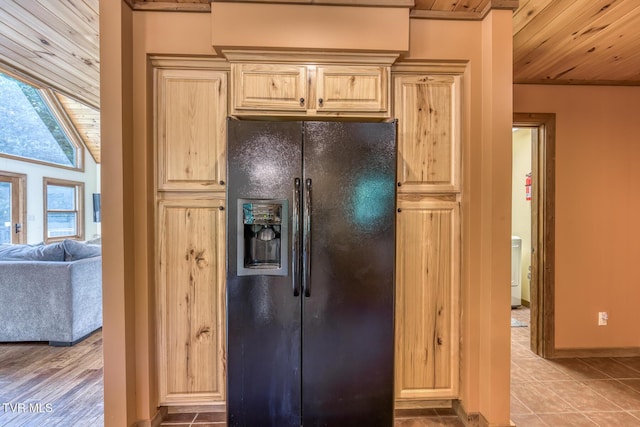 410 Eagle Ridge Rd, Roan Mountain, TN 37687 - kitchen featuring black fridge, light brown cabinetry, wood ceiling, and tile patterned floors